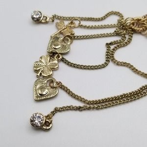Gold Tone Lariat Necklace with Dangling Charms Hearts, Dragonfly & 4 Leaf Clover